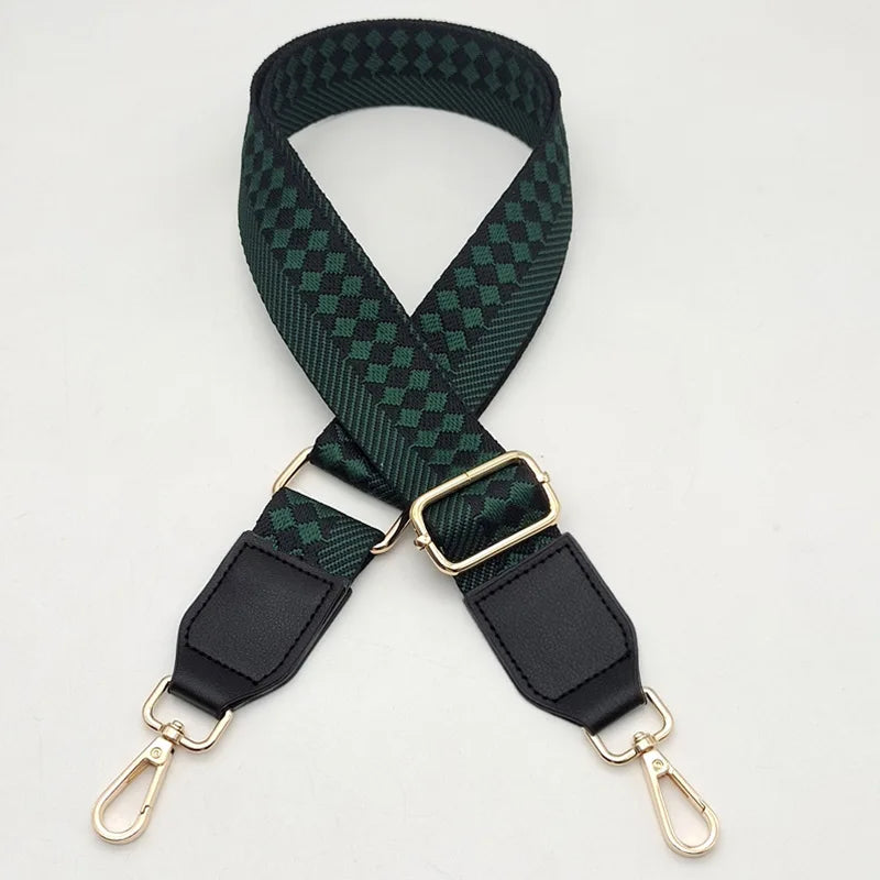 A dark green checkered braided nylon bag strap with gold-toned metal hooks.