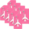 A set of pink silicone luggage tags shaped like airplanes with silver clasps.