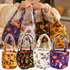 A collection of Halloween non-woven tote bags in purple, orange, and black featuring ghost, bat, and skull designs.