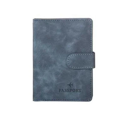 A dark gray leather passport holder organizer with a flap closure.