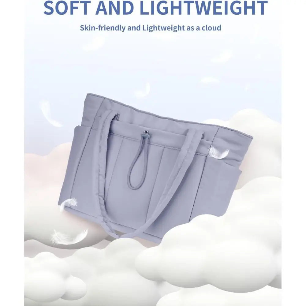 A light purple quilted padded tote bag with multiple pockets shown against a white fluffy background.