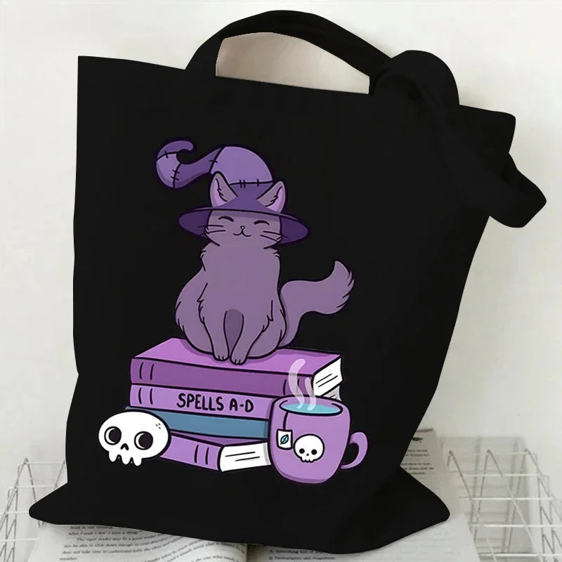 Black canvas tote bag featuring a purple cat and butterfly design on the front.
