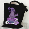 Black canvas tote bag featuring a purple cat and butterfly design on the front.