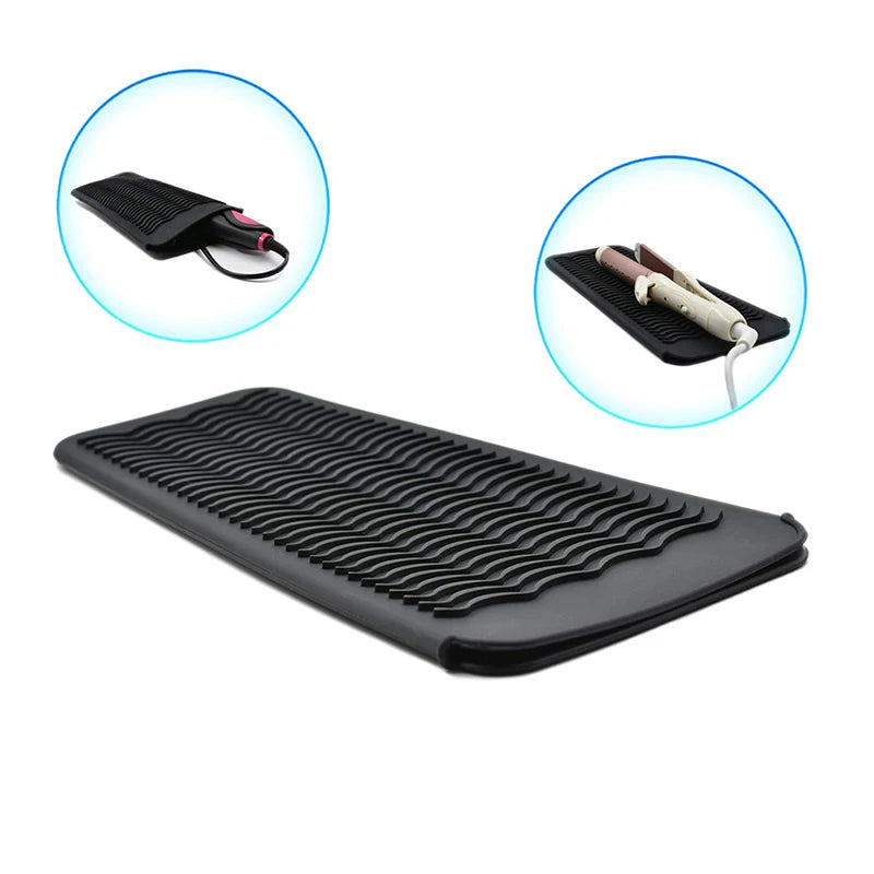 Black heat-resistant silicone mat designed to protect styling tools.