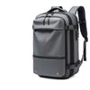 A gray heavy duty laptop backpack featuring vacuum compression features and black straps.