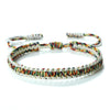 Handmade braided rope bracelet featuring colorful mixed fibers and adjustable knotting.