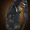 A tactical chest bag in camouflage pattern with a black strap and webbing visible.