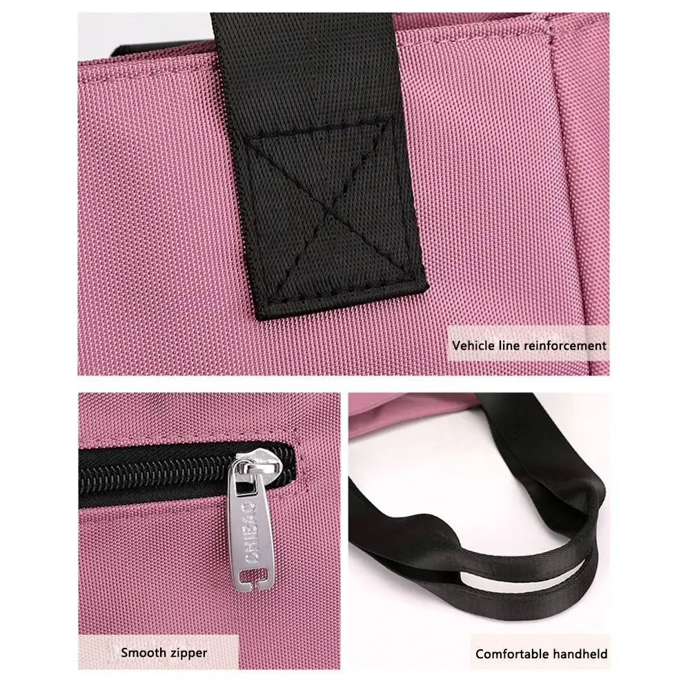A pink nylon shoulder tote bag featuring a black reinforced line and a silver zipper pull.