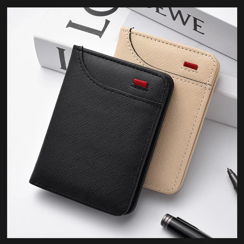 A black slim bifold wallet for men with multiple card slots resting next to a beige version and some pens.