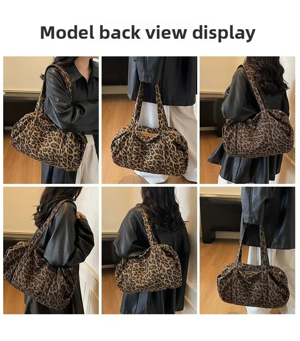 Model back view display of a leopard print canvas tote bag with an adjustable shoulder strap.