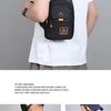A person wearing a white t-shirt holds a black Oxford crossbody sling bag with an orange accent.