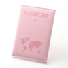 A pink passport wallet made of PU leather featuring a world map design and an airplane icon.