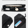 Internal storage display showing a black clutch bag with internal patch and card pockets.