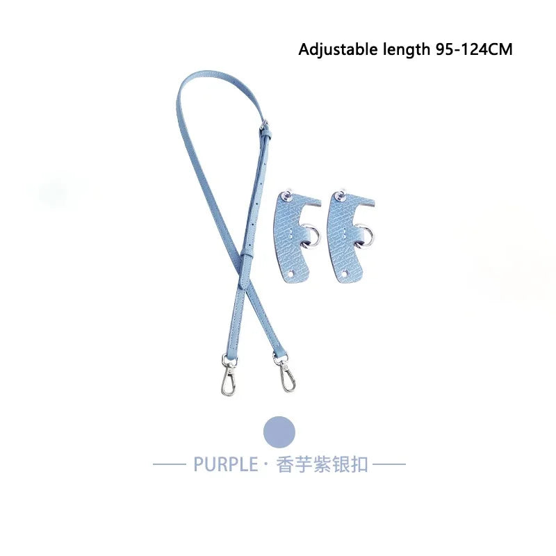 A light blue adjustable leather crossbody strap with a purple accent.
