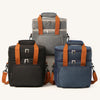 Trois sacs de pique-nique isothermes à double paroi en noir, gris et bleu avec des sangles orange.