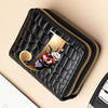 A black PU leather double-zip clutch wallet with a gold accent and a floral cartoon print.