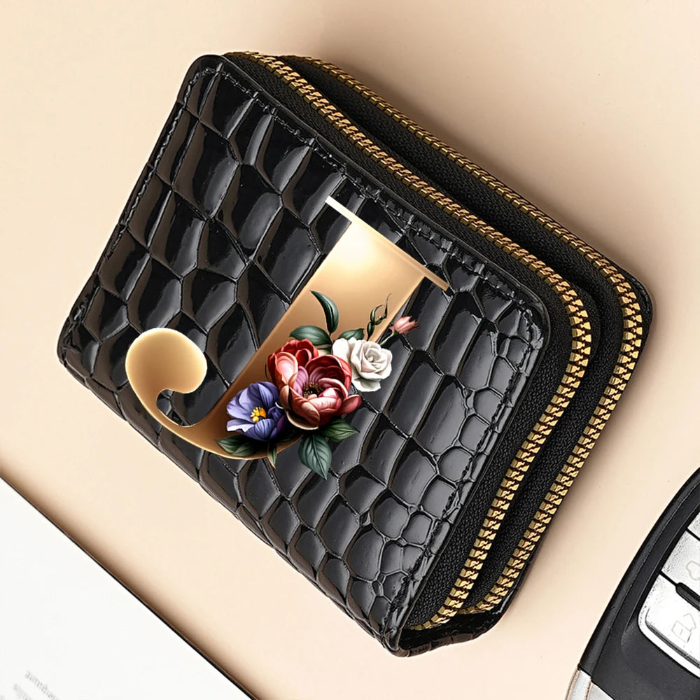 A black PU leather double-zip clutch wallet with a gold accent and a floral cartoon print.