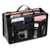 Black multi-pocket organizer tote bag holding various cosmetics and essentials like a phone and lipsticks.