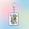 A silver keychain featuring a square charm with pixel art of Deltarune chibi characters.