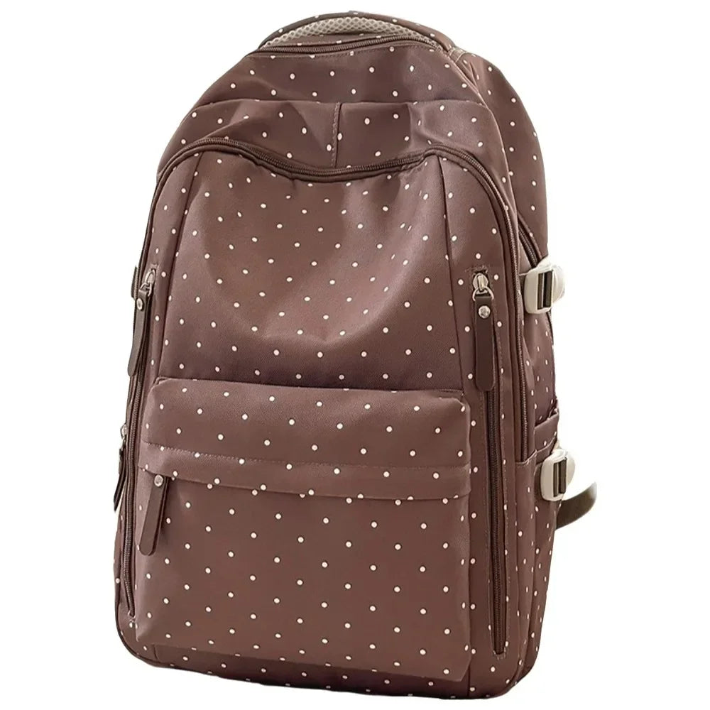 A brown corduroy backpack with a white polka dot pattern and light beige trim.