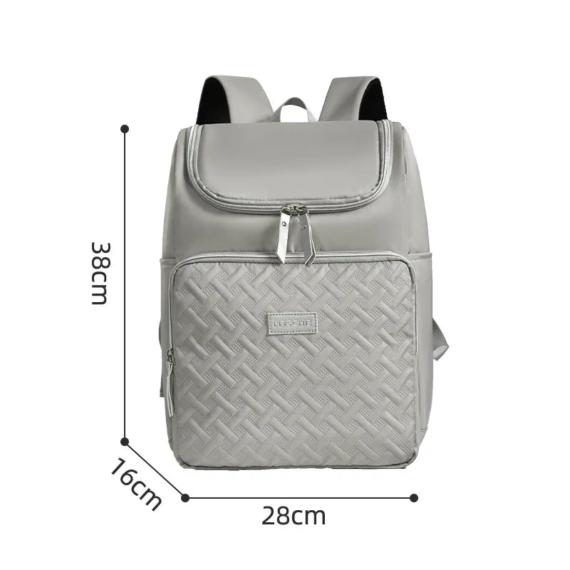 A gray insulated travel backpack shown from the back with dimensions 38cm high and 28cm wide.