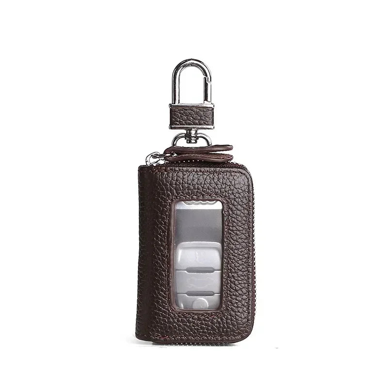 Brown leather car key case with a metal hook and a transparent window.