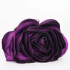 A deep purple velvet rose floral evening clutch bag with a silver chain strap.