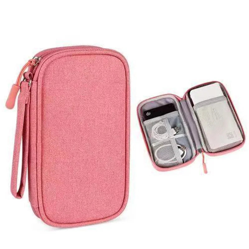 A pink waterproof cable organizer storage bag with an open compartment showing various cables and accessories.