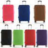 A row of five luggage protectors in various colors including pink, blue, brown, black, and purple.