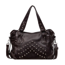 A black leather tote bag featuring decorative silver rivets and stitching.