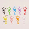 Assorted metal keychain clasp set featuring various star shapes in black, green, blue, purple, and red.