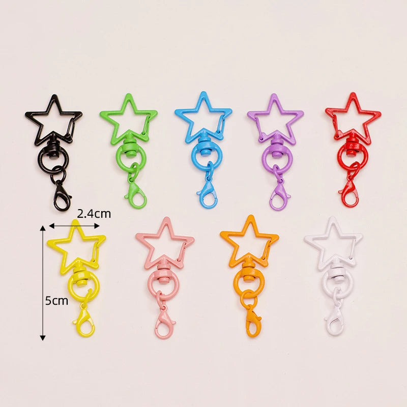 Assorted metal keychain clasp set featuring various star shapes in black, green, blue, purple, and red.
