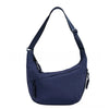 Navy canvas crossbody bag with adjustable strap and zipper detail