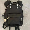 A black Mickey Mouse-themed fashion backpack with a large front pocket and shoulder straps.
