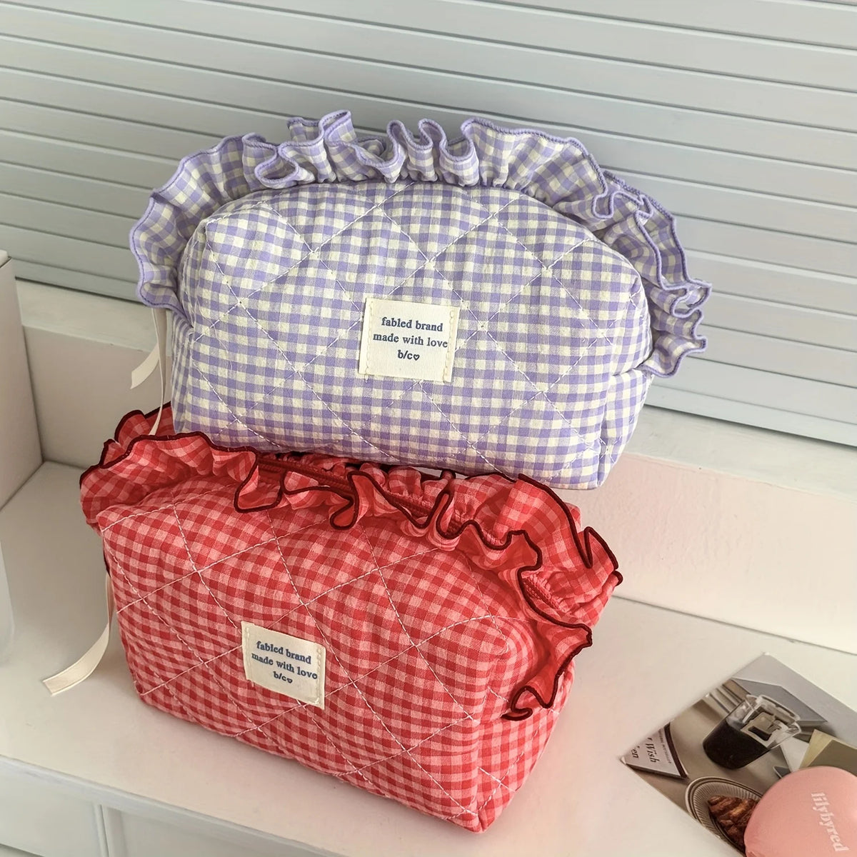 Red and white checkered makeup pouch with ruffled lace trim