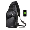 Black men's casual crossbody chest bag with a visible USB charging port.
