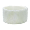 White silicone boot sleeve for water bottles with a textured, beaded pattern.