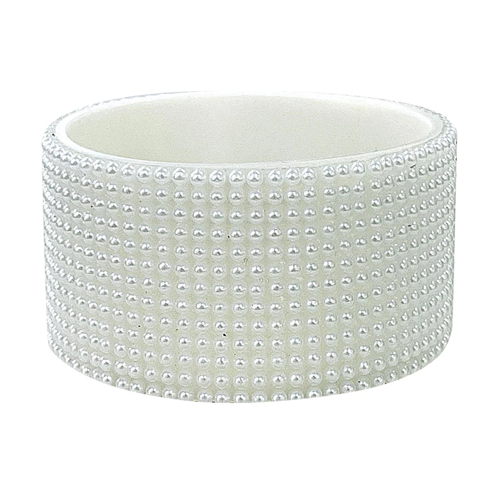 White silicone boot sleeve for water bottles with a textured, beaded pattern.