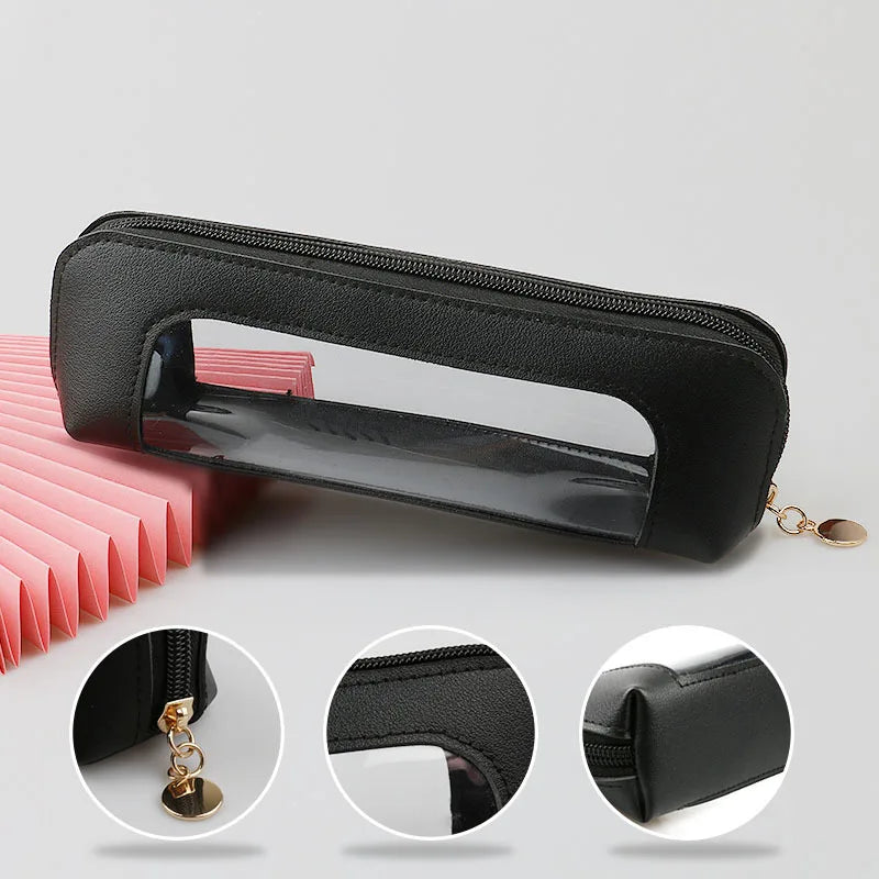 A black portable cosmetic organizer pouch with a transparent window and gold chain detail.
