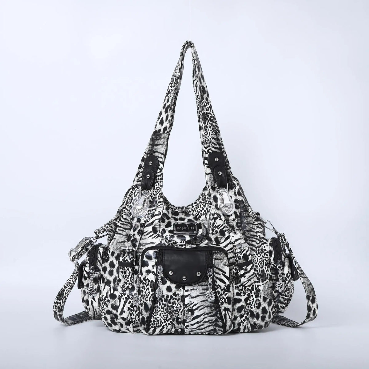 A black and white leopard print vintage PU leather hobo shoulder bag with a flap closure.