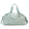 A light mint green nylon duffel bag with padded straps and a diagonal design.