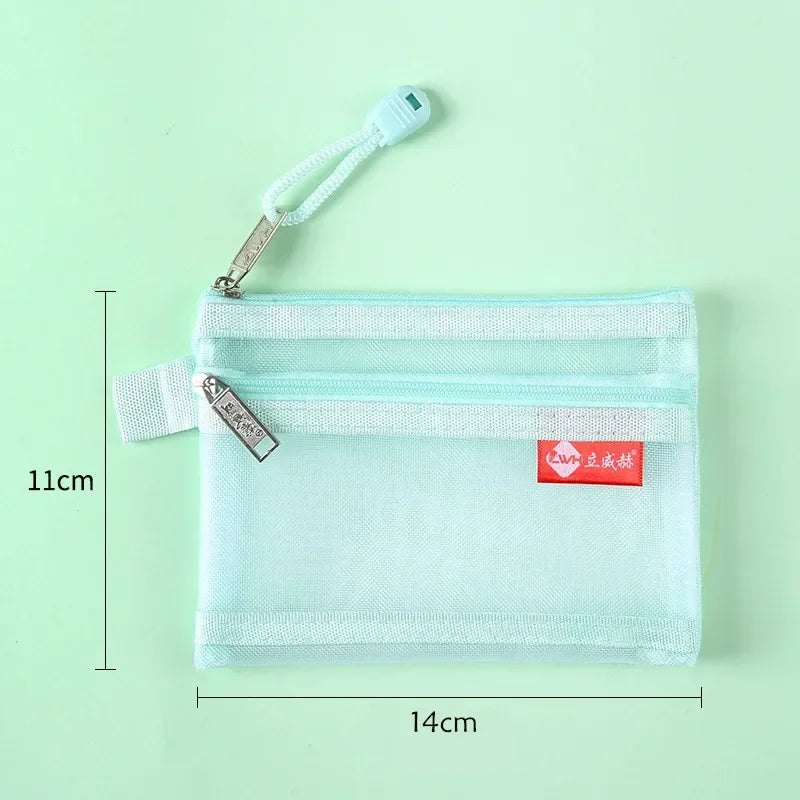 Light blue fabric pouch with a zipper closure and attached strap, shown against a light green background.