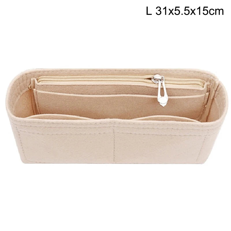 Light beige felt bag insert organizer with a zipper and a small charm