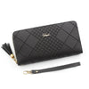 A black quilted clutch wallet with gold hardware and a leather strap is shown on a white background.