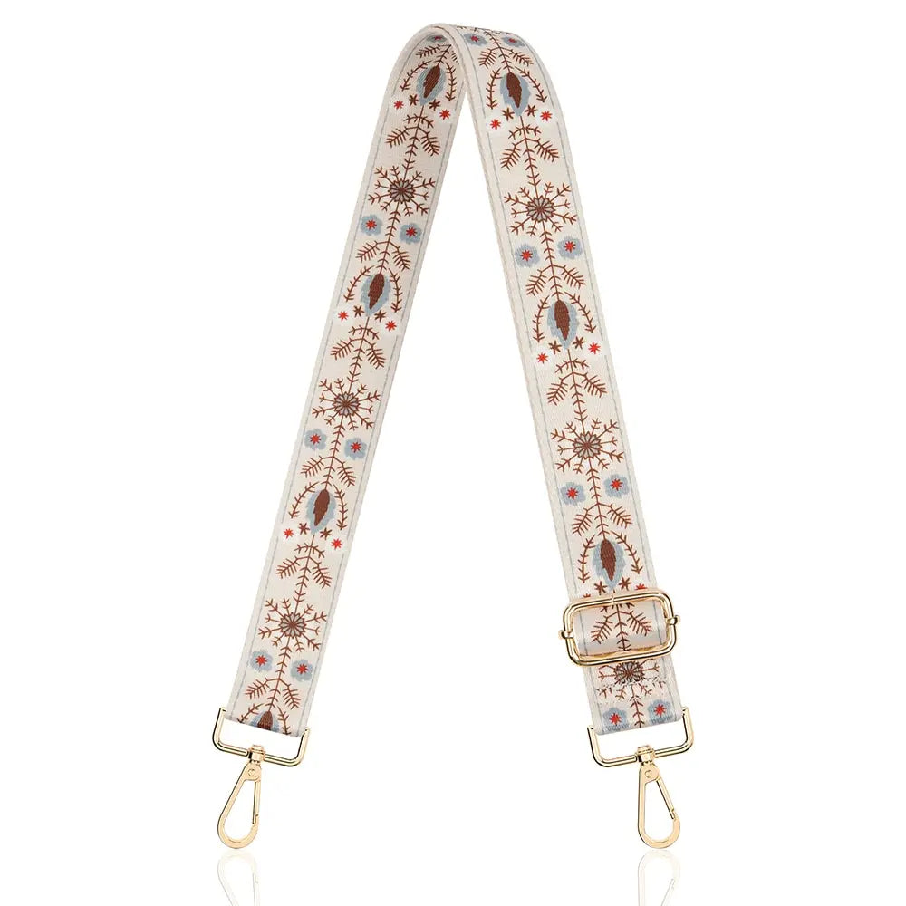 A beige and brown patterned nylon crossbody bag strap with gold-toned hardware.