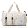 A beige nylon travel duffle bag with a quilted pattern and light tan straps.