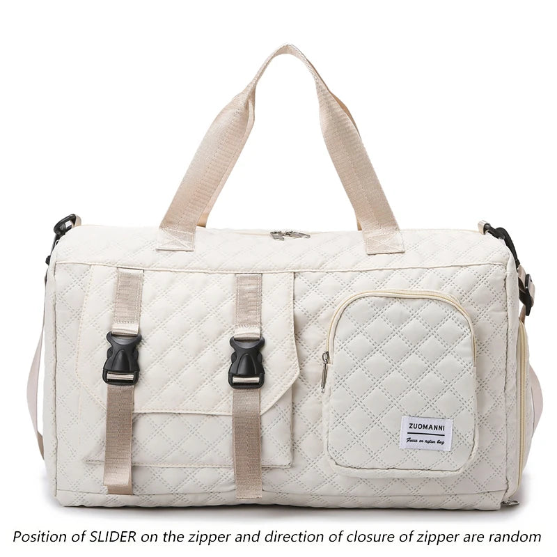 A beige nylon travel duffle bag with a quilted pattern and light tan straps.