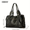 A black vintage washed leather tote bag with a drawstring closure and shoulder straps.