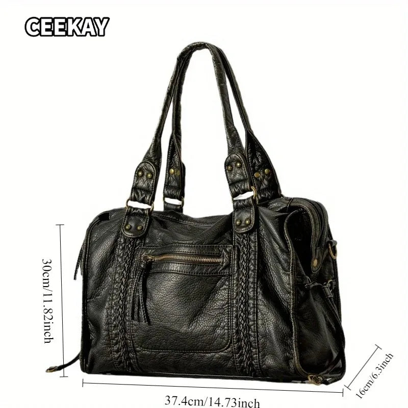 A black vintage washed leather tote bag with a drawstring closure and shoulder straps.
