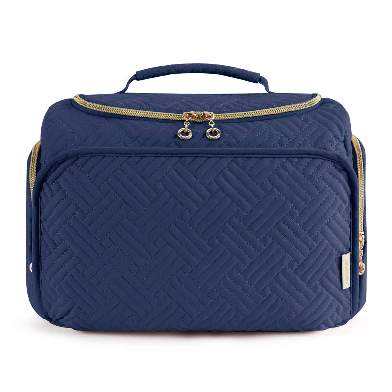 Navy quilted cosmetic organizer bag with a gold-toned zipper and handle